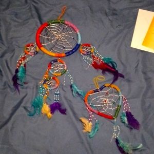 One dreamcatcher and one small heart-shaped dreamcatcher, both handmade